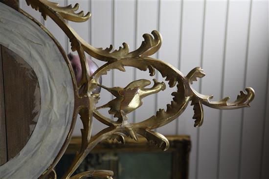 A Victorian oval gilt wall mirror, 4ft 11in. x 2ft 9.5in.